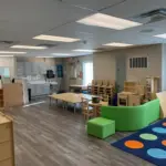 interior modular daycare facility preschool childcare room with table and chairs