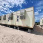 A row of connected construction site modular buildings